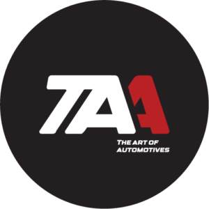 The Art of Automotives circular logo featuring stylised white “TAA” lettering with a red accent on a black background